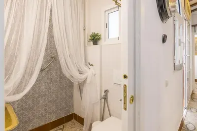 Un baño de Deluxe Divina Apartment