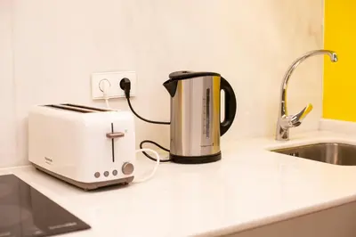 Una cocina o zona de cocina en WISH SUITE Puerta Osario