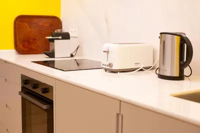 Una cocina o zona de cocina en WISH SUITE Puerta Osario