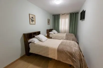 Cama o camas de una habitación en Americahome