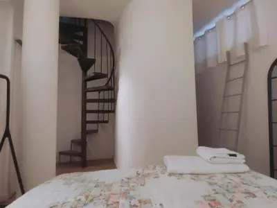 Cama o camas de una habitación en El Alma de Sevilla