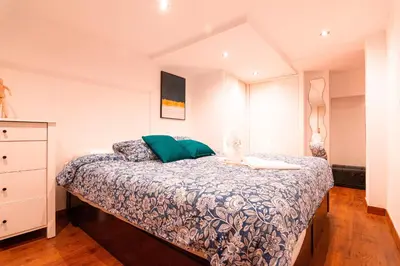 Cama o camas de una habitación en Edomus Santiago Duplex