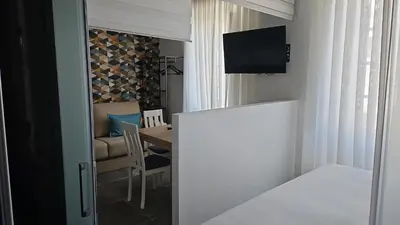 Una televisión o centro de entretenimiento en Suite Mateo