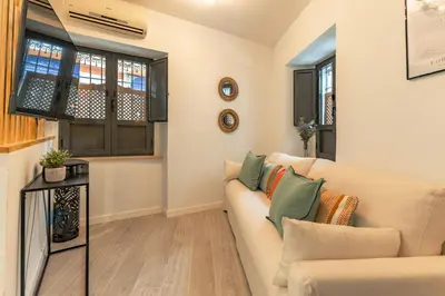 Una televisión o centro de entretenimiento en Ohliving Muro de los Navarros