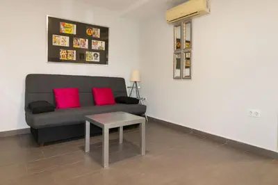 Zona de estar de Acogedor Apartamento con Patio en el Corazón de Sevilla , Junto a Plaza San Marcos