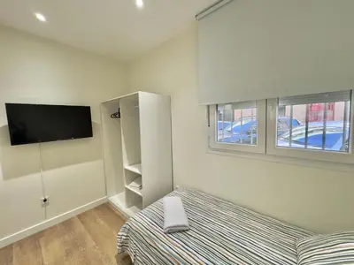 Cama o camas de una habitación en ApartHome SanRomán