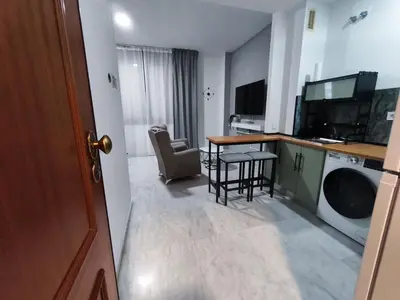 Una cocina o zona de cocina en Apartamento FIBES II edificio LUX SEVILLA