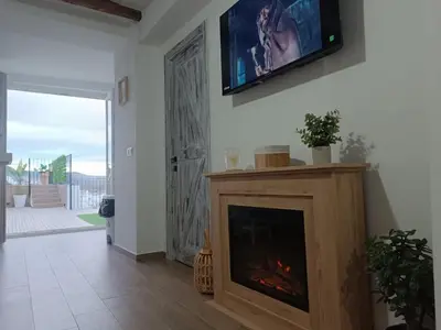 Una televisión o centro de entretenimiento en 'El Paraiso de la Villa' by Turismodecalidad