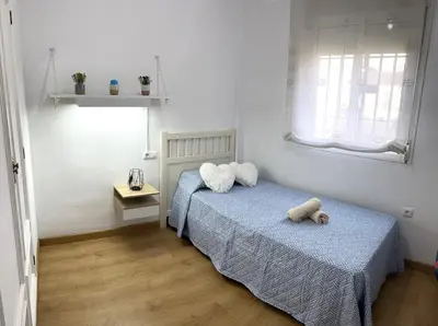 Cama o camas de una habitación en Bonita casa adosada