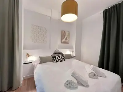 Cama o camas de una habitación en Alhondiga Luxury