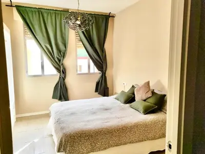 Cama o camas de una habitación en Happy Sevilla