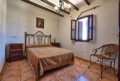 Cama o camas de una habitación en Cortijo Los Alazores, authentic cortijo with private pool