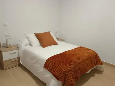 Cama o camas de una habitación en Apartamentos La Fuente