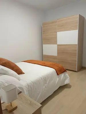 Cama o camas de una habitación en Apartamentos La Fuente