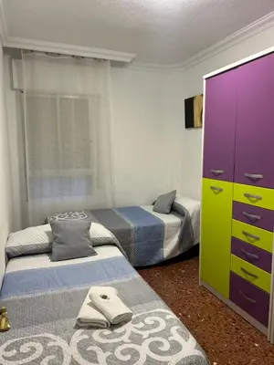 Cama o camas de una habitación en Apartamento espacioso El Olivo