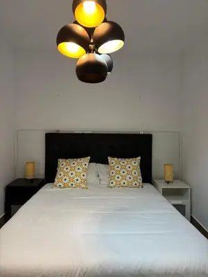 Cama o camas de una habitación en Alohamundi Santa Clara