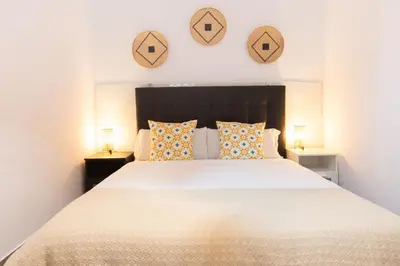 Cama o camas de una habitación en Alohamundi Santa Clara