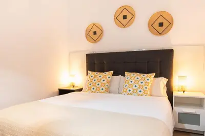 Cama o camas de una habitación en Alohamundi Santa Clara