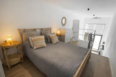 Cama o camas de una habitación en RentalSevilla Alejo Fernández II