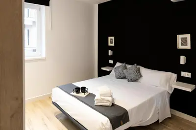 Cama o camas de una habitación en Alojamientos Carola Julio Burell, 74
