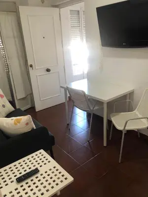 Una televisión o centro de entretenimiento en Apartamento Alameda 3ºA