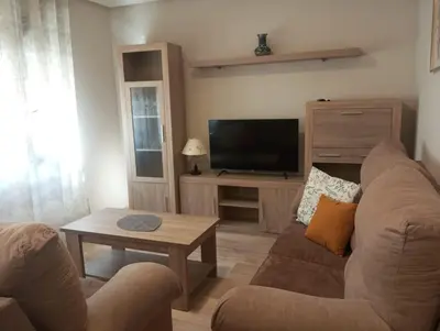 Una televisión o centro de entretenimiento en PLAZA AYUNTAMIENTO 3 HaBITACIONES B&A