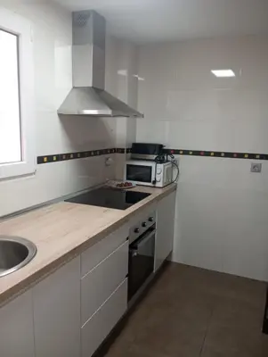 Una cocina o zona de cocina en PLAZA AYUNTAMIENTO 3 HaBITACIONES B&A