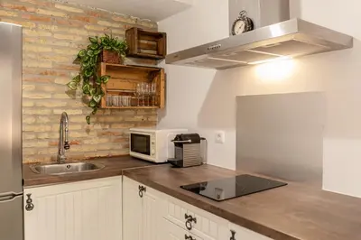 Una cocina o zona de cocina en Casas de Sevilla - Casa Descalzos
