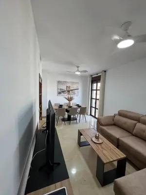 Una televisión o centro de entretenimiento en Apartamento Centro Puente Romano