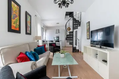 Una televisión o centro de entretenimiento en Dúplex Sta Rufina