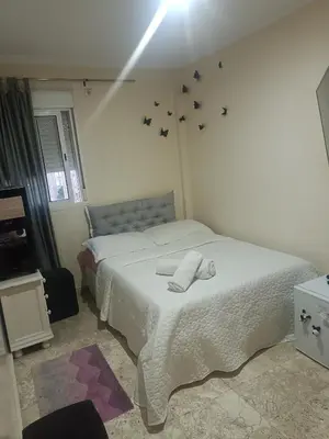 Cama o camas de una habitación en bonita habitación el apartamento compartido con todas las comodidades se sentirán como muy bien