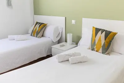 Cama o camas de una habitación en El Rincón de la Muralla