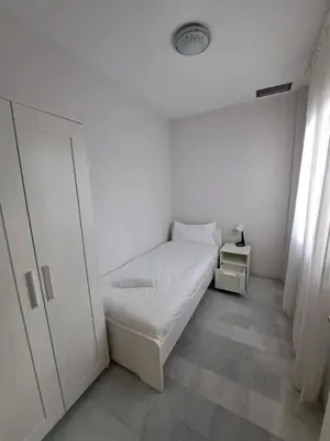 Cama o camas de una habitación en Selecta Apto con dos dormitorios en patio tradicional