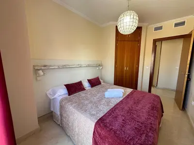 Cama o camas de una habitación en Piso en Linares zona Paseo con parking gratis