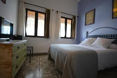 Cama o camas de una habitación en Hotel Casa de los Azulejos