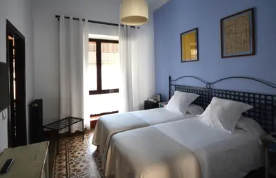 Cama o camas de una habitación en Hotel Casa de los Azulejos