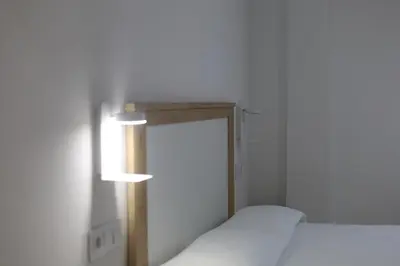 Cama o camas de una habitación en Hospedium GL Andújar Boutique