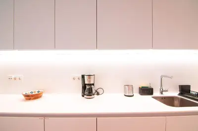 Una cocina o zona de cocina en Edomus Puerta de la Barqueta