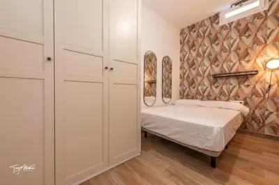 Cama o camas de una habitación en Sarmiento, Apartamentos la Cepa