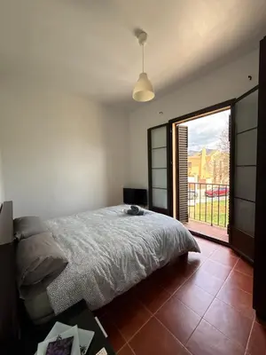Cama o camas de una habitación en #1 HABITACIÓN DOBLE con baño compartido SEVILLA DELUXE LOS ROSALES