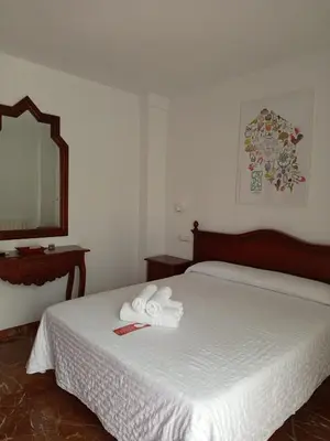 Cama o camas de una habitación en Hotel La Ribera
