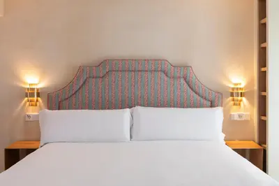Cama o camas de una habitación en Magno Apartments San Agustín