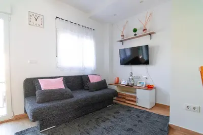 Una televisión o centro de entretenimiento en Edomus Ciudad Jardin