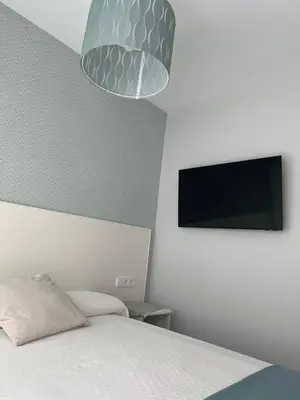 Una televisión o centro de entretenimiento en Luxury apartment downtown Sevilla