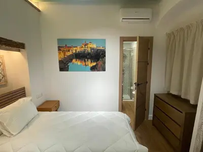 Cama o camas de una habitación en Hospedería El Reloj 2 bedrooms