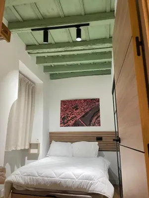 Cama o camas de una habitación en Hospedería El Reloj 2 bedrooms
