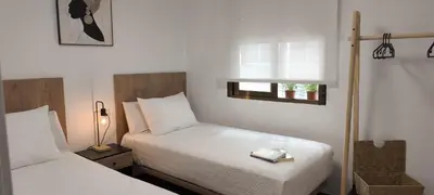 Cama o camas de una habitación en Vistas a la mezquita