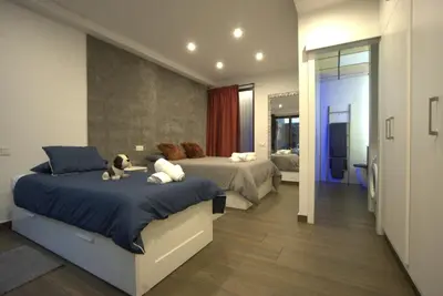 Cama o camas de una habitación en San Marcos Suite II