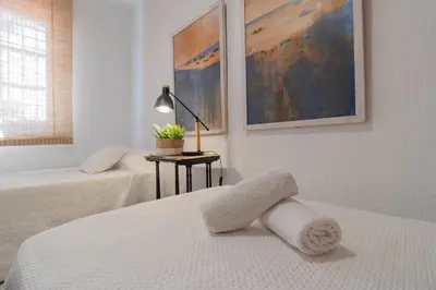 Cama o camas de una habitación en Califato Premium