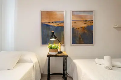 Cama o camas de una habitación en Califato Premium